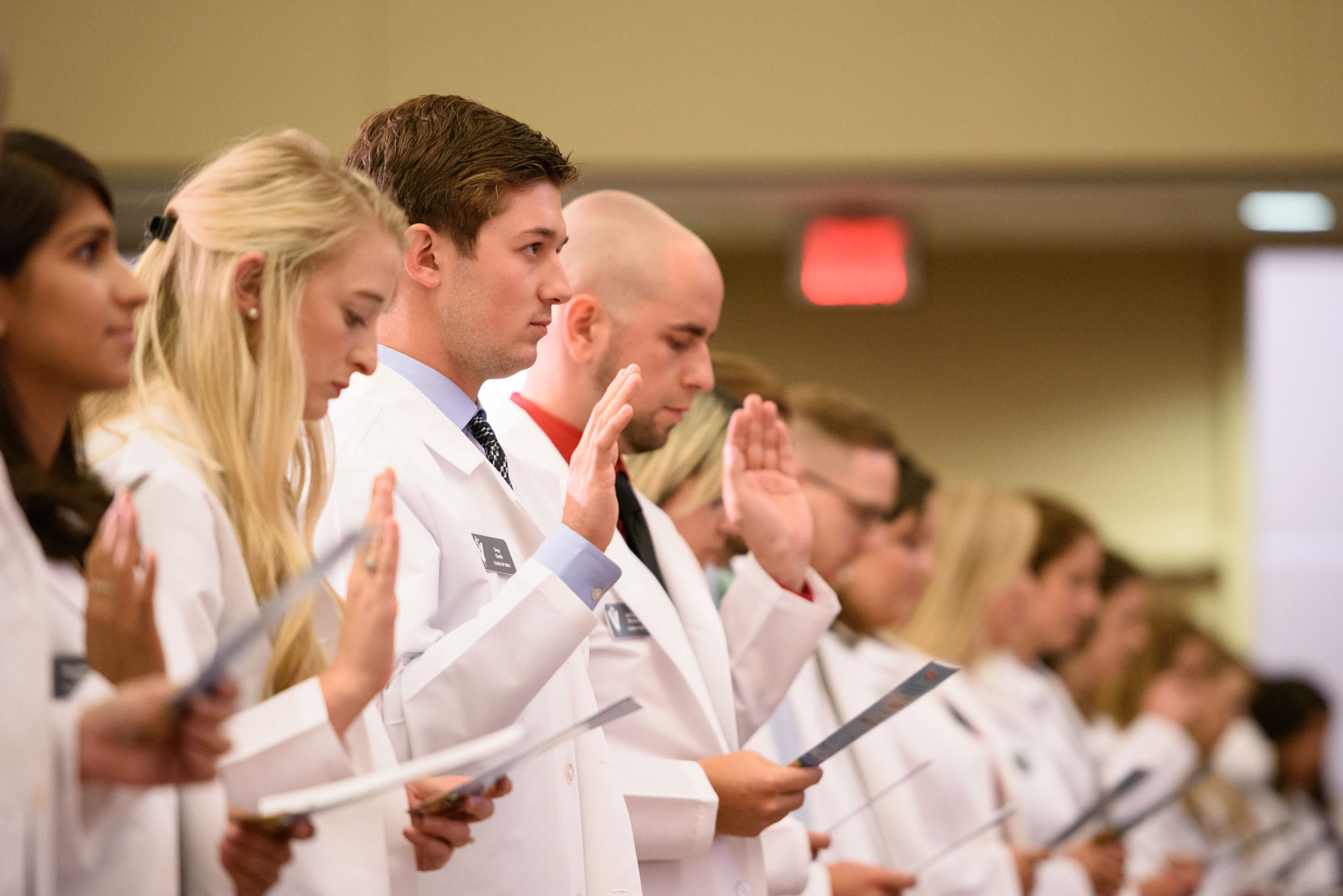 veterinarian graduates taking the oath