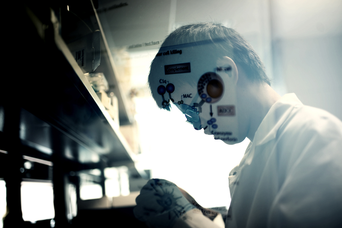 A student/researcher works in a lab.