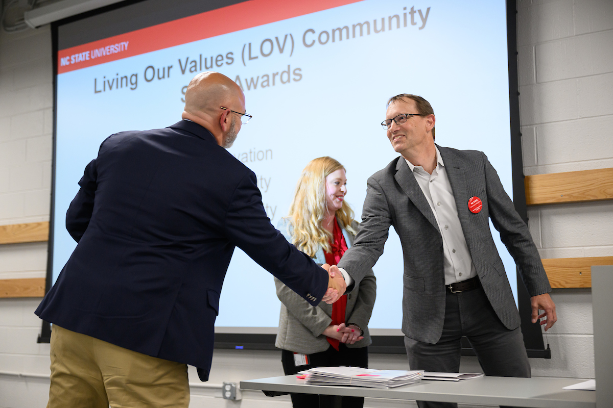 Two people shaking hands.