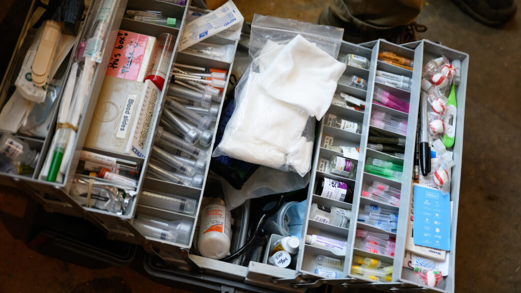 A toolkit with various compartments holds medications, syringes, and other medical materials used at the North Carolina Zoo.