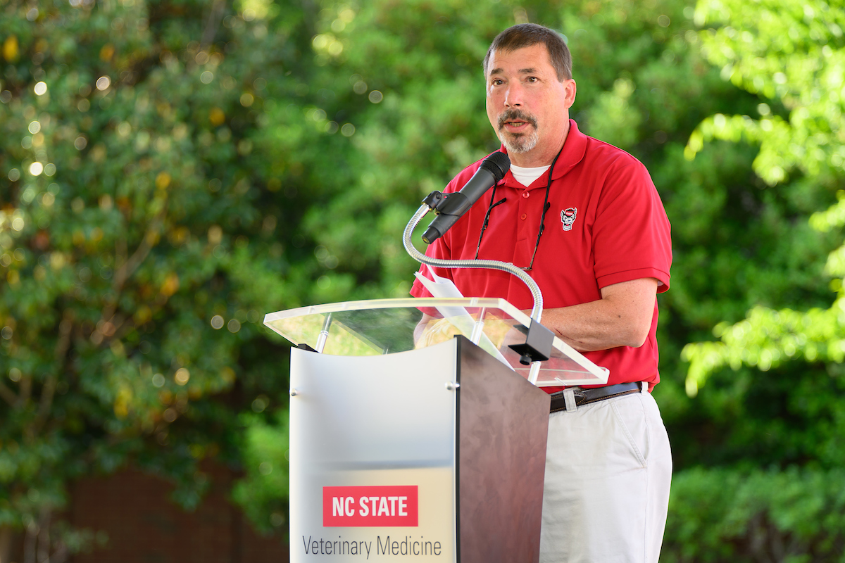 Sam Jones at a podium. 