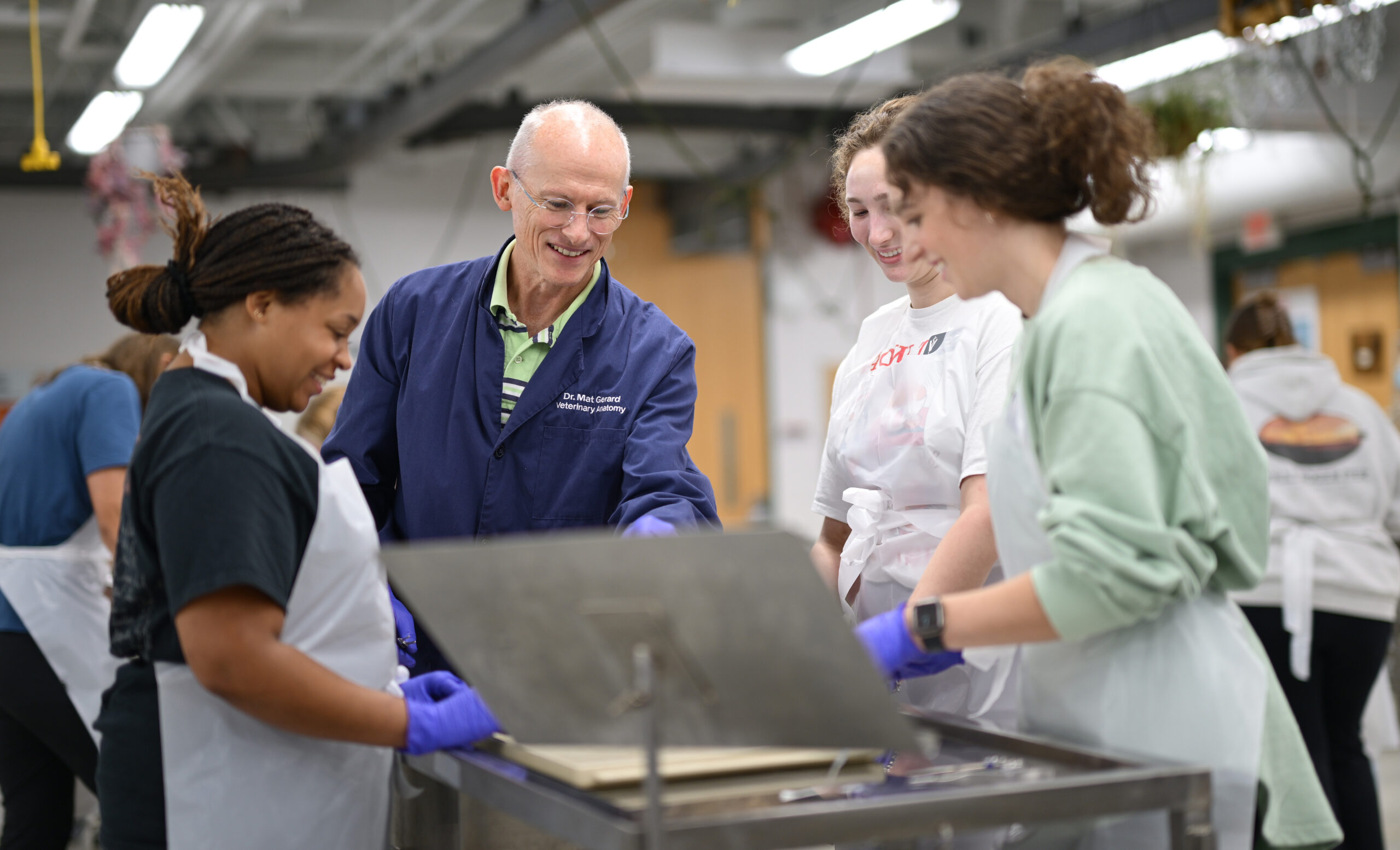 A professor instructs two students.
