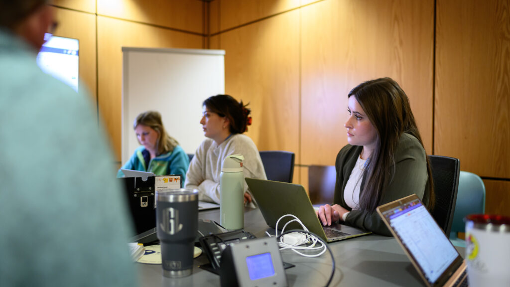 Dr. Donnell listens during morning rounds in a conference room at the NC State Veterinary Hospital.