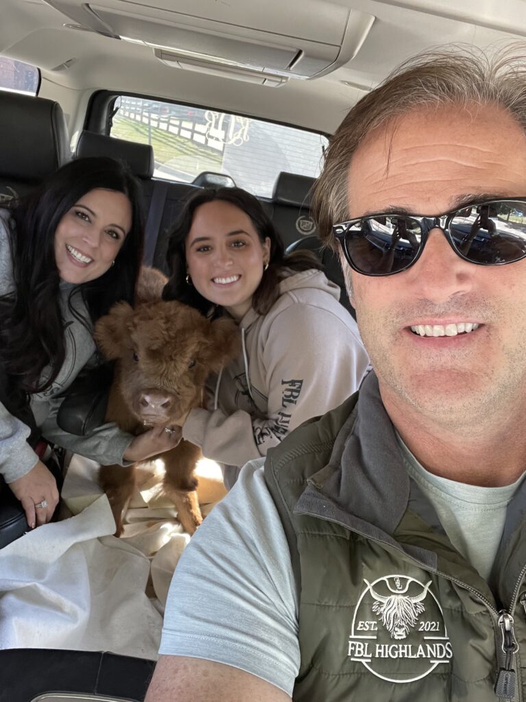 Three members of the Dawkins family pose with Starlight in the car on her way home from the NC State Veterinary Hospital in October.