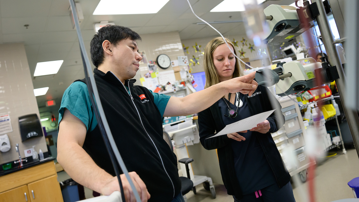 Dr. Yu Ueda works in the NC State Veterinary Hospital's ICU.
