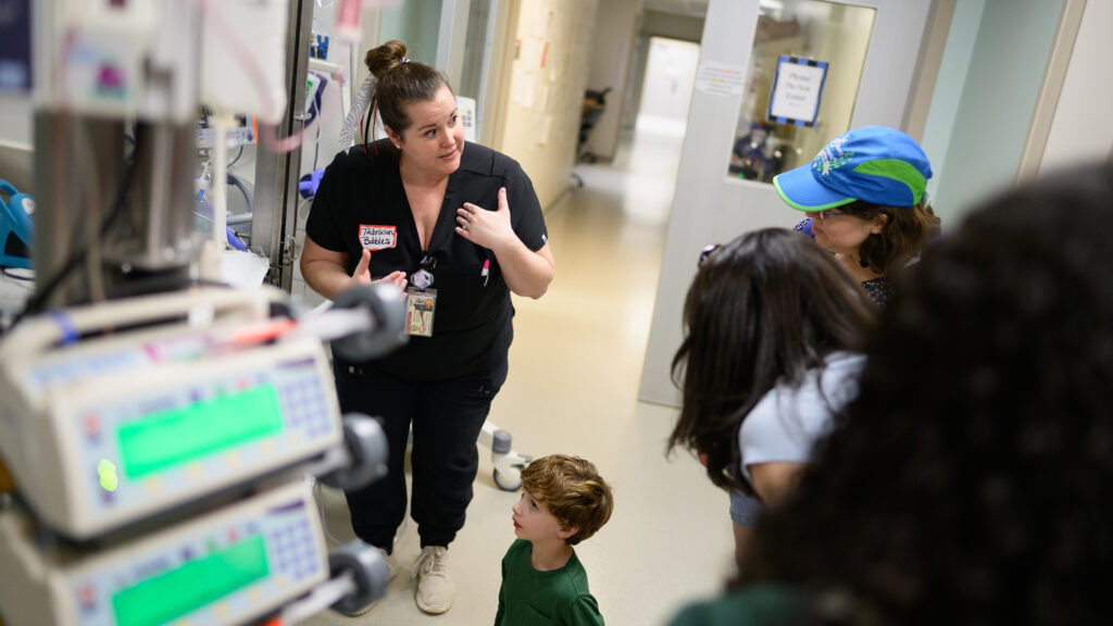 Animal care technician Stefanie Lajuett runs a resuscitation station inside the Veterinary Hospital