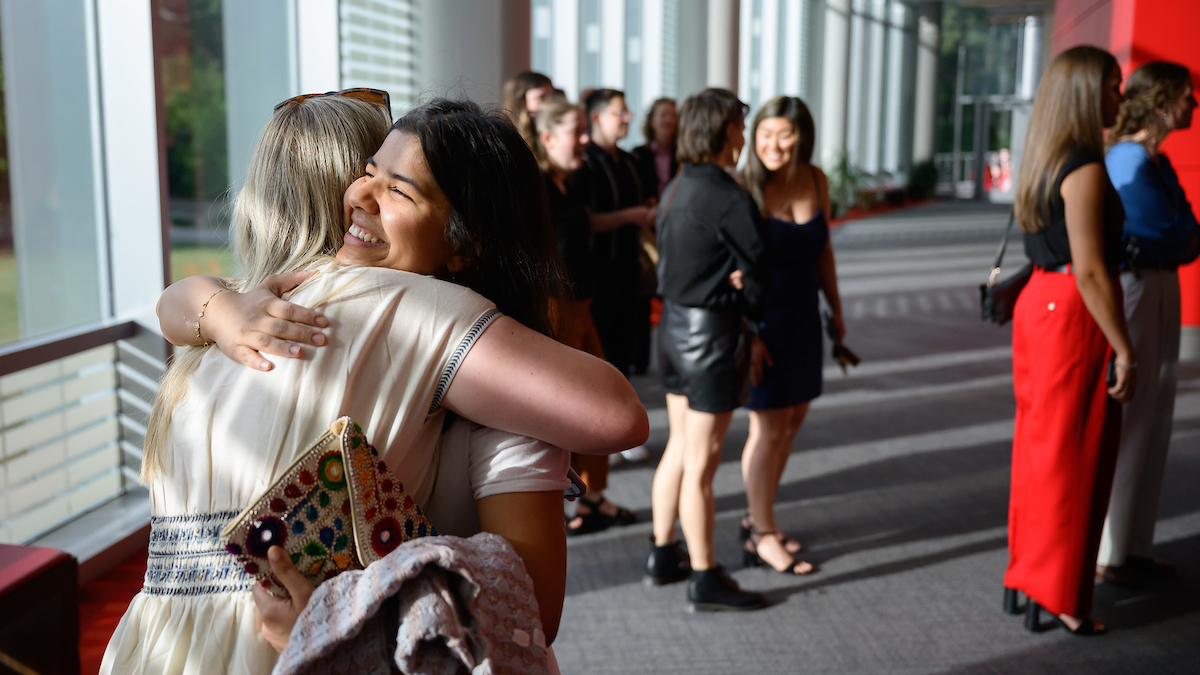 two women hug